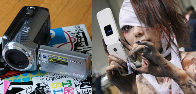 Sony Handycam video camera or camcorder, HDD 80 gb, zoom and photos. Japanese girl with cell phone, wrapped mummy bandages and long fingernails.