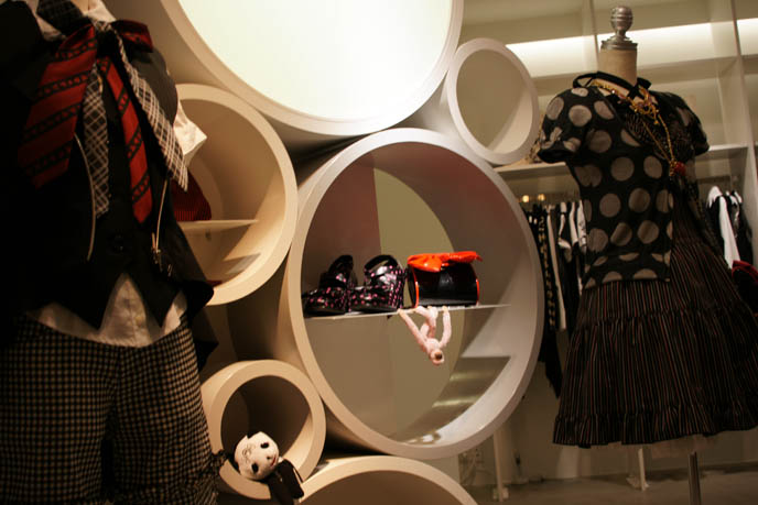 Cool circular shelves, designer modern furniture, 1960s bubble shelf in boutique. Black Peace Now store in Marui One Shinjuku, Gothic Lolita designer fashion, puff petticoats, bell shaped skirts, polka dot tops. Where to buy Japanese women's clothing, cute stores in Tokyo Japan, shopping map.