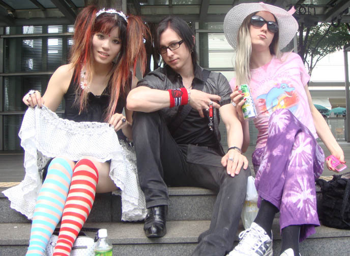 Gackt concert in Tokyo, Japan, Saitama arena. Japanese J-rock star, Visual Kei, Malice Mizer singer. Gackt Camui nose job plastic surgery, band outfits, Visual Kei feminine cross-dressing rock stars, live photos and videos, transsexual wearing hat.