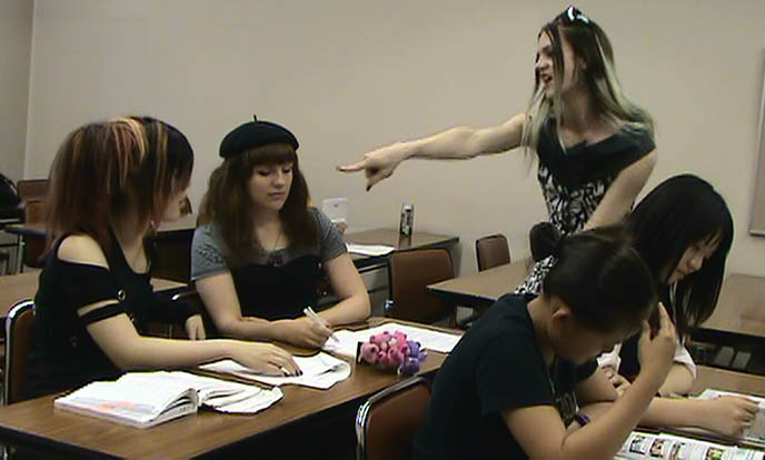 teacher pointing at student yelling, FUNNY J-HORROR MOVIE. TOKYO GHOST STORY WITH DRAG QUEENS, COSPLAY & JAPANESE SCHOOLGIRLS, cross-dressing, goth fashion in Japan, DJ Sisen Tokyo Decadance, cute Swedish male model, transsexuals clothing and makeup