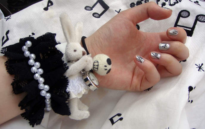 Putumayo white rabbit alice in wonderland watch, silver Japanese nail art from dollar store stickers, hellcatpunks skull logo, bracelet or hair accessory Goth Lolita Punk, Metamorphose temps de fille musical notes dress.
