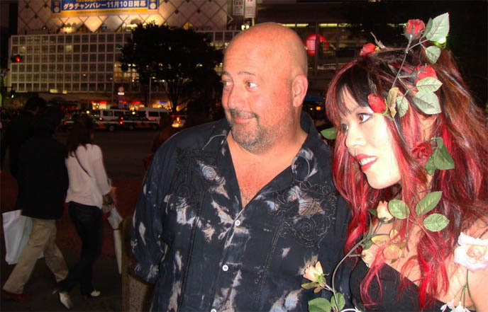 Andrew Zimmern's Bizarre World TV show on Travel Channel, Discovery, popular weird foods program, Hachiko statue at Shibuya subway, filming lost in translation famous Center Gai street crossing, busy Tokyo Japan street crossing, bring neon lights of Tokyo Japanese signs