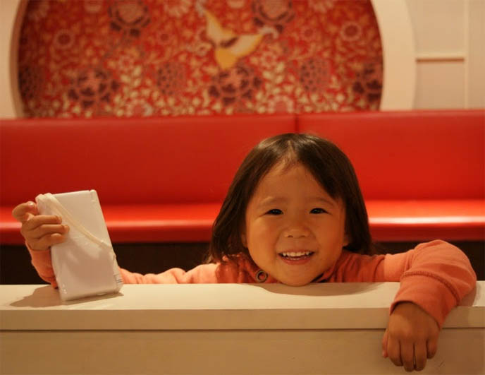 cute chinese kid, little girl, TOKYO'S ODAIBA: LITTLE HONG KONG. DAIBA MANMADE ISLANDS, SHOPPING & CHINESE FOOD, WEIRD THEME PARKS JAPAN. weirdest strangest theme restaurants, crazy wacky theme restaurants, hong kong replica movie set